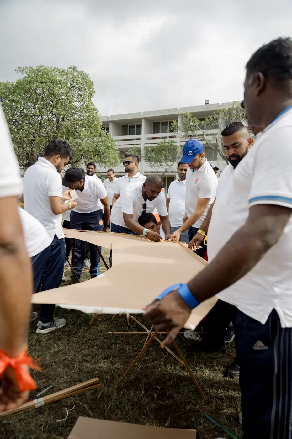 A team solving a collaborative construction challenge