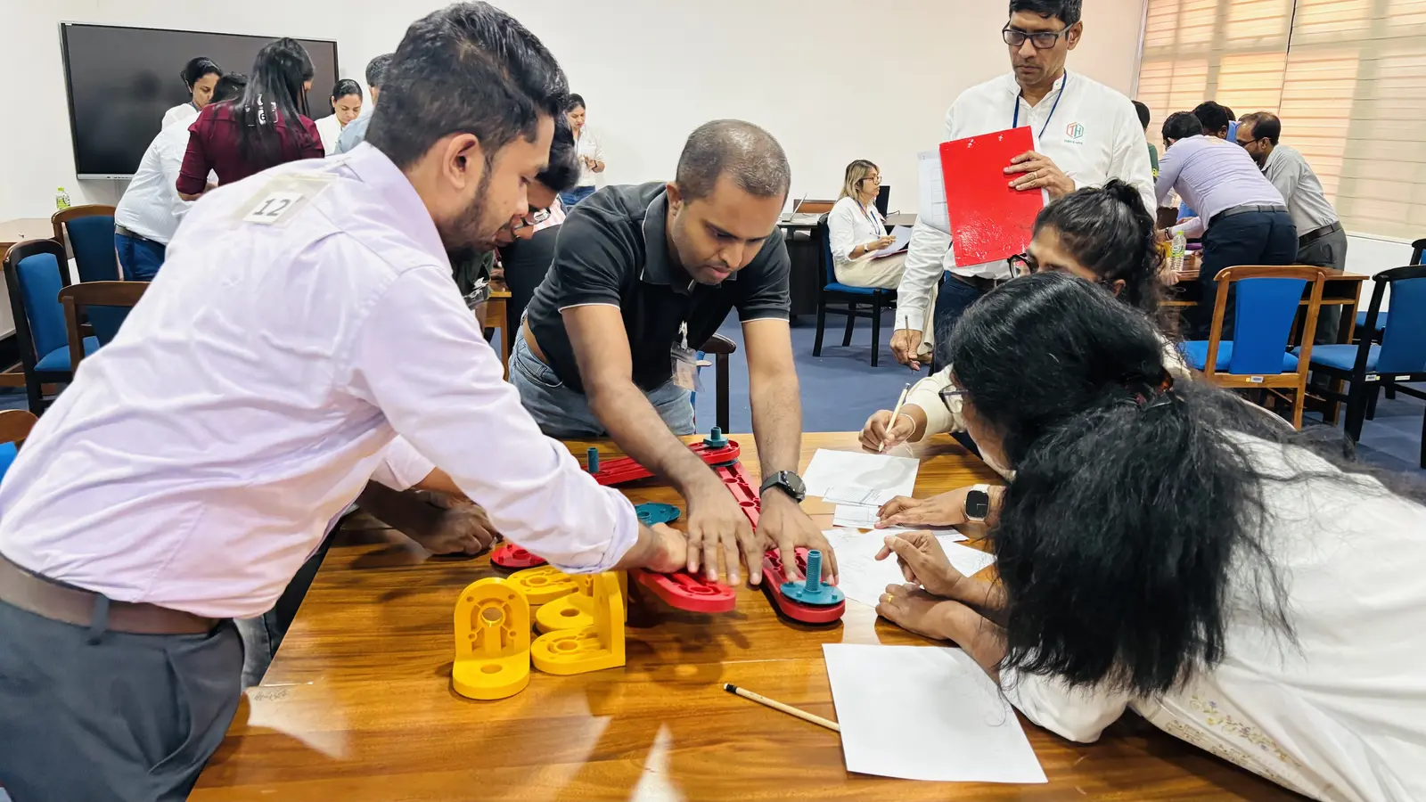 Participants completing a hands-on assessment activity