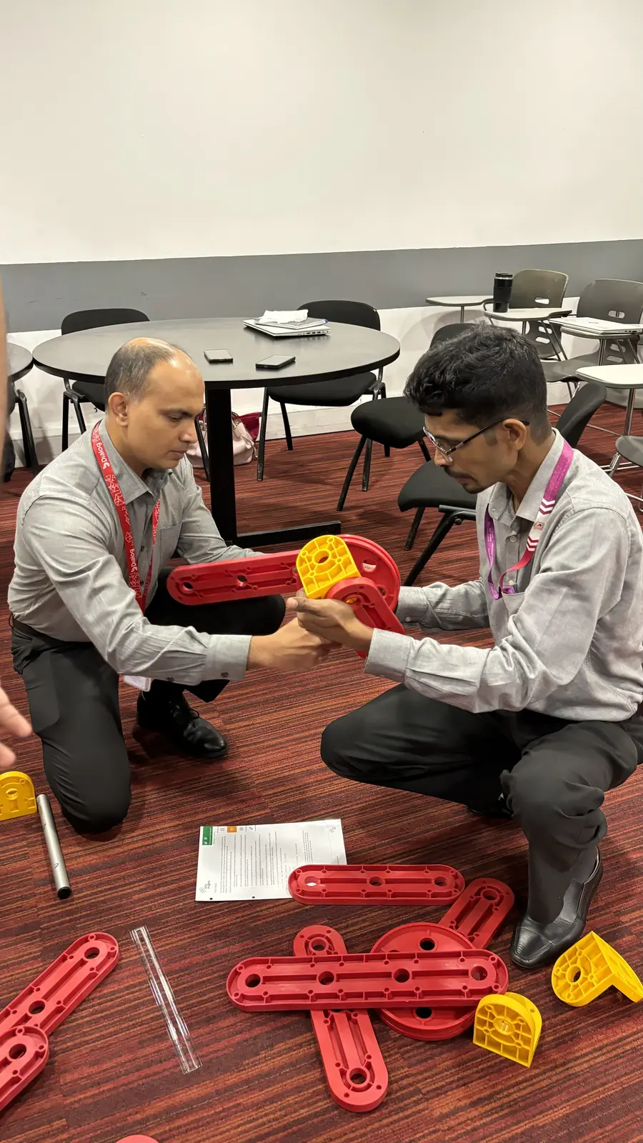Participants collaborating with an MTa Hoist activity